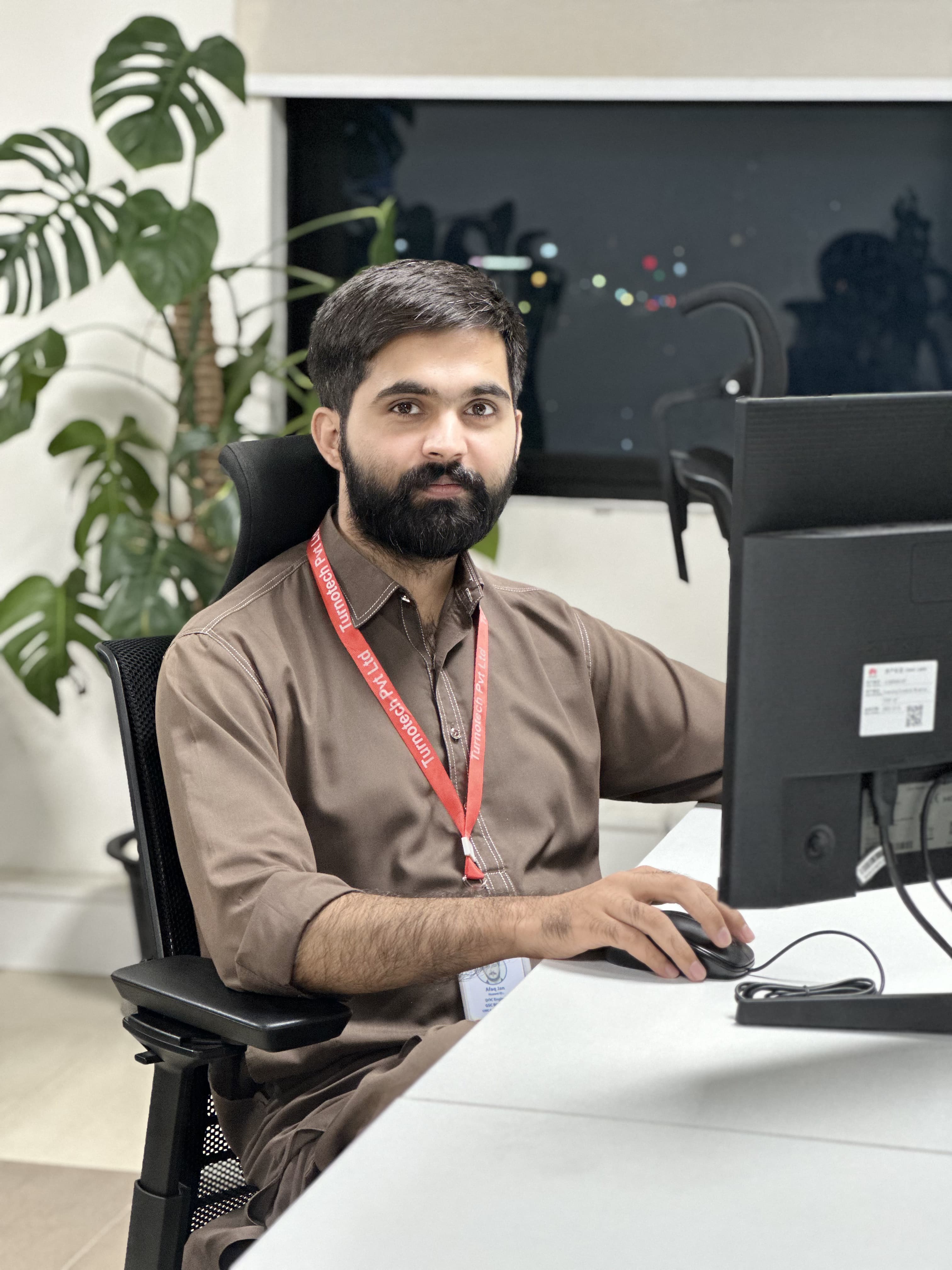 Hamza Bashir at his workstation